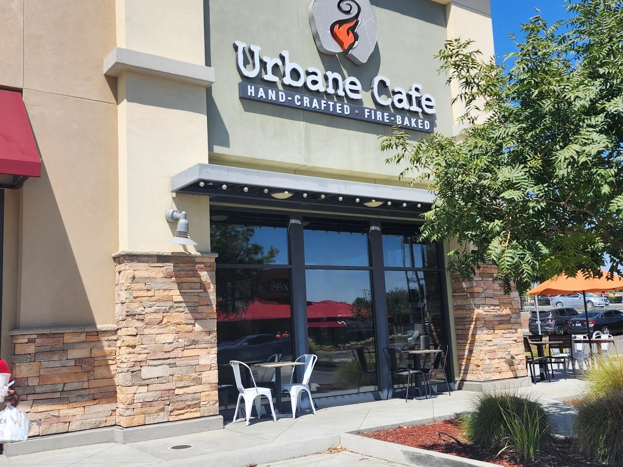 Commercial solar window film installed across the glass storefront of Urbane Cafe