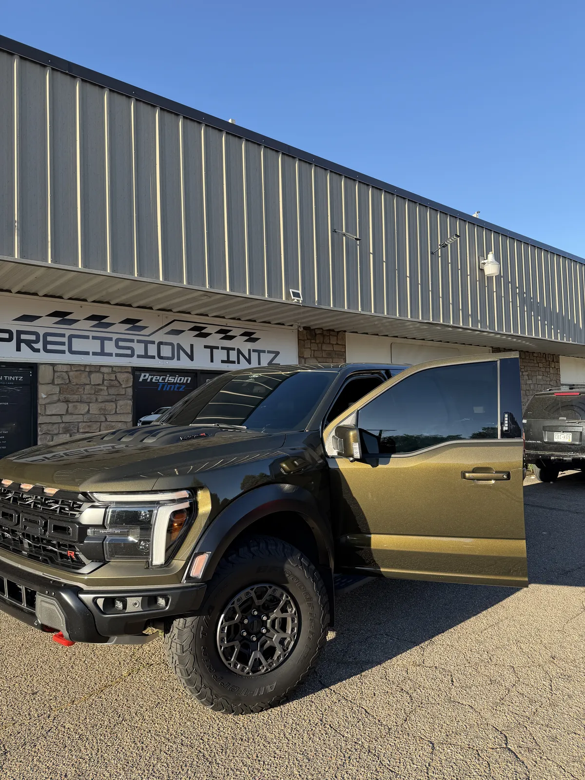 Finished vehicle outside Precision Tintz after mobile-ready tint and appearance work