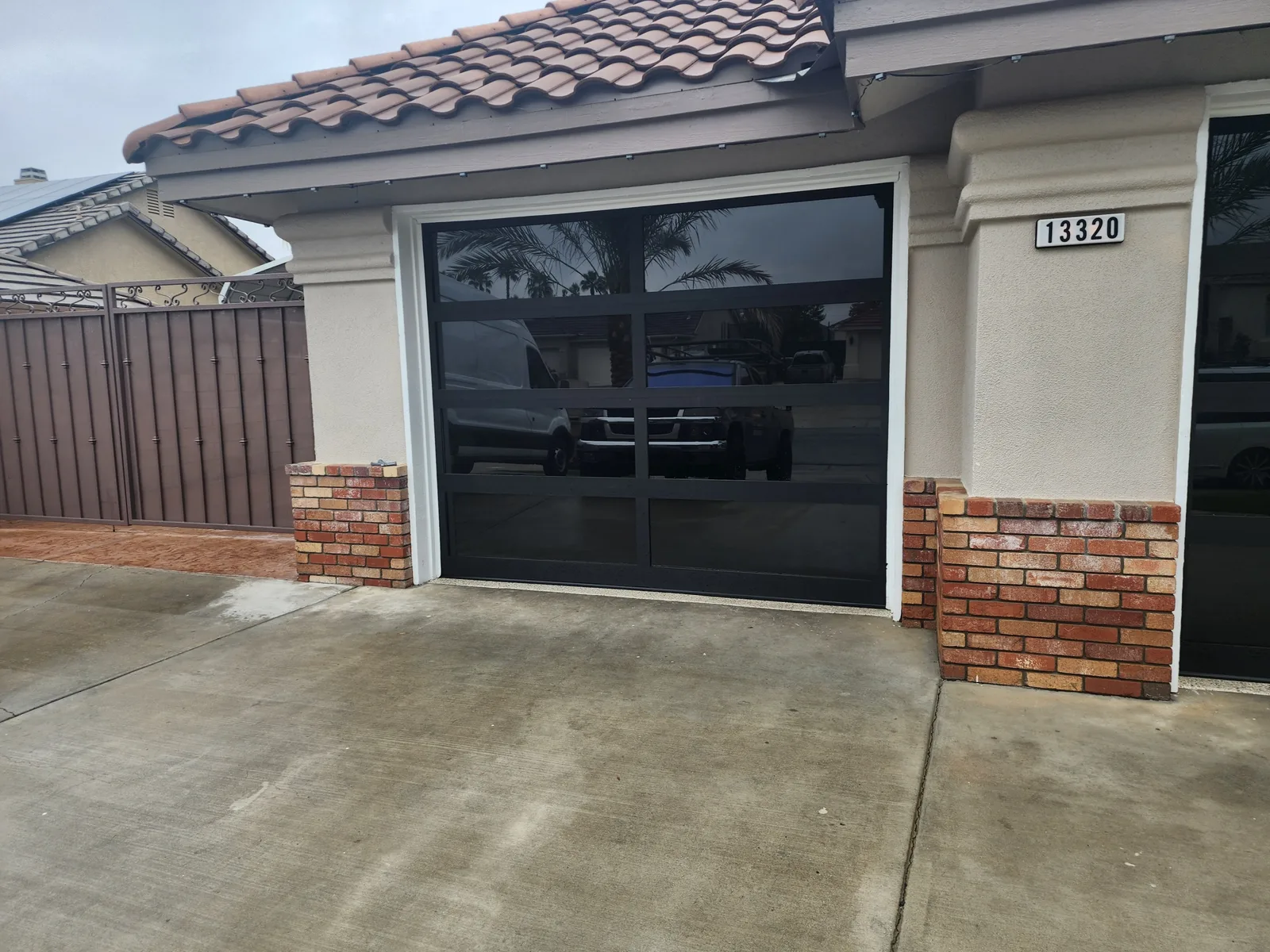Residential window film installed on a modern glass garage door